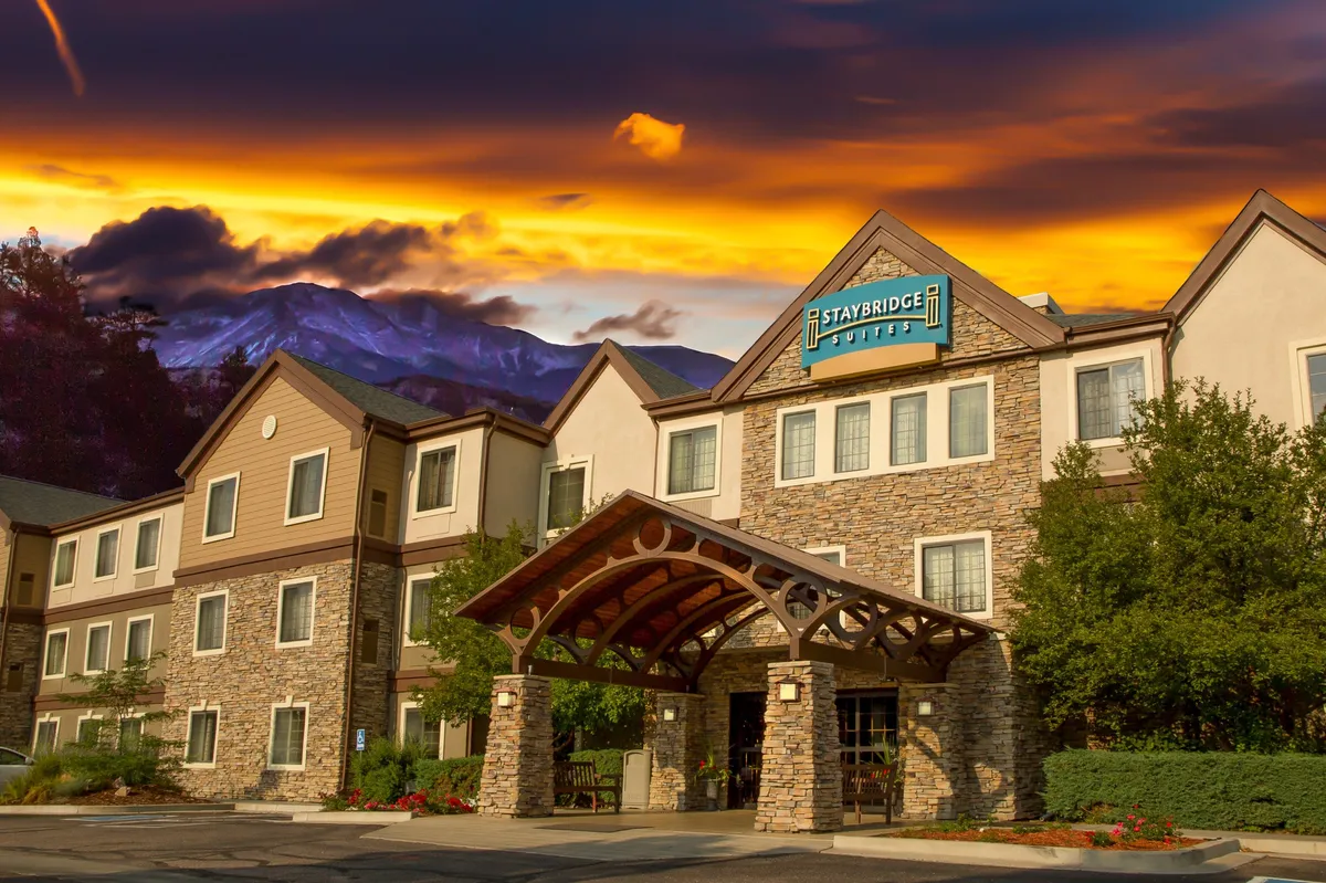 This image features the inviting exterior of the property with a charming stone facade, wooden awning, and clear signage. The warm, welcoming atmosphere signals attentive guest services and a well-maintained environment, suggesting a place where convenience and care are top priorities.
